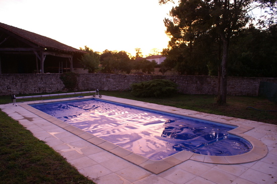 Pool with cover at dusk